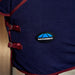 Close-up of the side of the navy blue cooler and hood with dark red trim and straps, featuring a circular Weatherbeeta logo patch on the side.