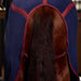 The back of a horse wearing a navy cooler trimmed in burgundy Features the burgundy leg straps wrapped around the back legs and up to the cooler. 
