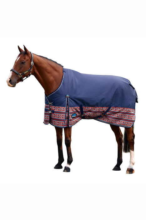 A brown horse wearing a navy blue horse blanket with a red and white patterned border, shown against a plain white background.