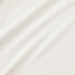 A close-up of a soft, off-white or cream-colored fabric with a fine ribbed texture and gentle diagonal folds.