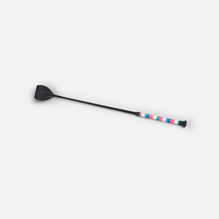A black equestrian riding crop with a colorful striped handle, shown diagonally on a light gray background.