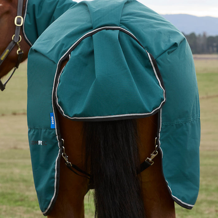 Back of a horse wearing a forest green  blanket with a hood in an outdoor setting