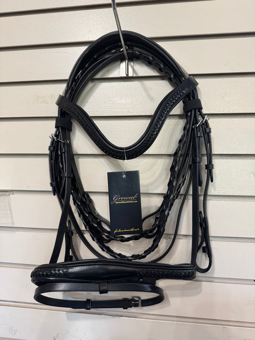 Black leather and braided equestrian bridle hanging on a wall display hook, with a black hangtag attached. The bridle includes a browband, bit area, cheekpieces, and reins, shown against a white slatwall background.