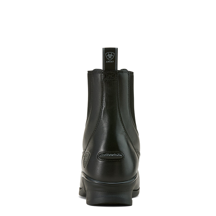 Rear View of black leather riding boot showing heel, spur rest and pull loop on white background
