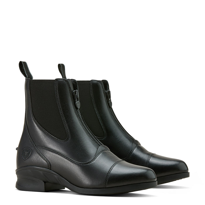 A pair of black leather riding boot with zipper closure and elastic at the ankle on a white background