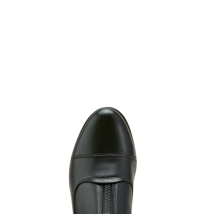 Rounded toe of black leather riding boot with portion of zipper closure and white background