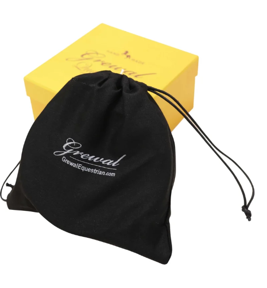 A black drawstring pouch with white 'Grewal' branding in the foreground, with a yellow branded box behind it on a white background.