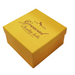 A square yellow gift box with a hinged lid, featuring the text 'Elegant Quality belts HAND MADE' printed in brown on the lid, set against a plain white background.