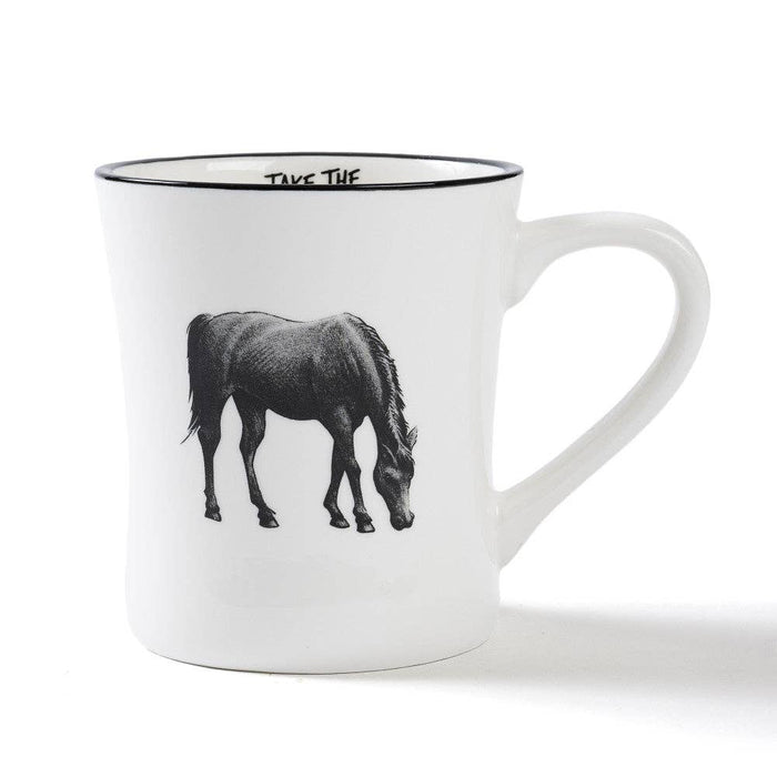 A white ceramic coffee mug with a black rim, featuring a black line art illustration of a horse grazing on the front. The inside of the mug is printed with the text 'TAKE THE'.