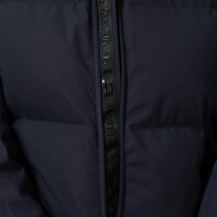 Close-up of a dark navy puffer jacket with a black zipper featuring the brand logo Horze printed vertically.