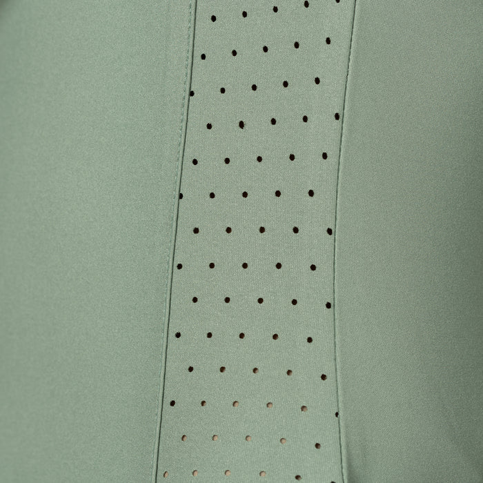 Green fabric with a row of small holes along one edge